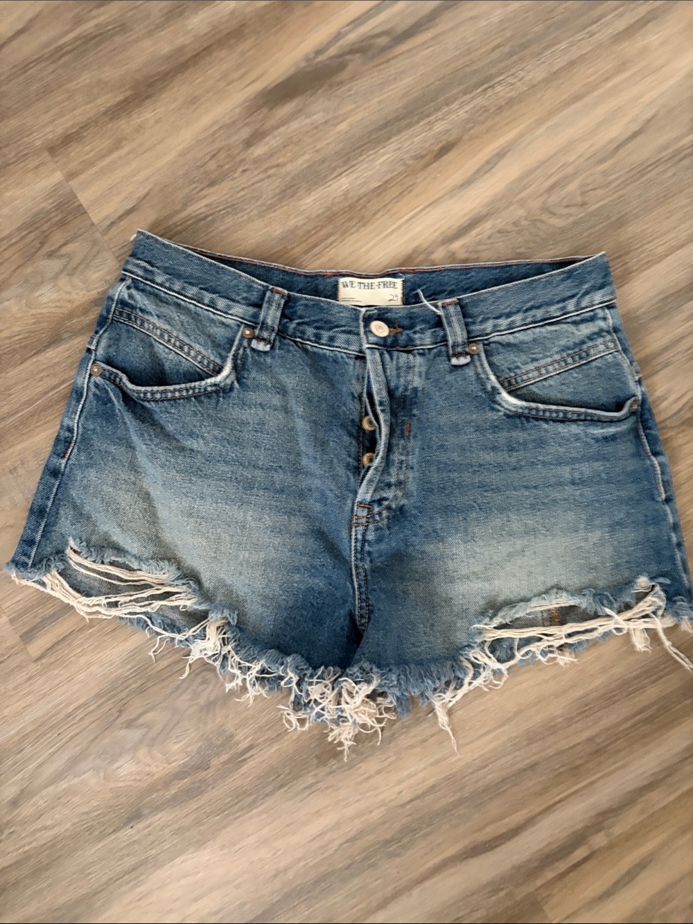 We The Free Distressed Medium Blue Denim Cutoff Shorts